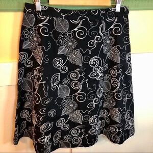 Black skirt side zip white stitched flowers Sz 10